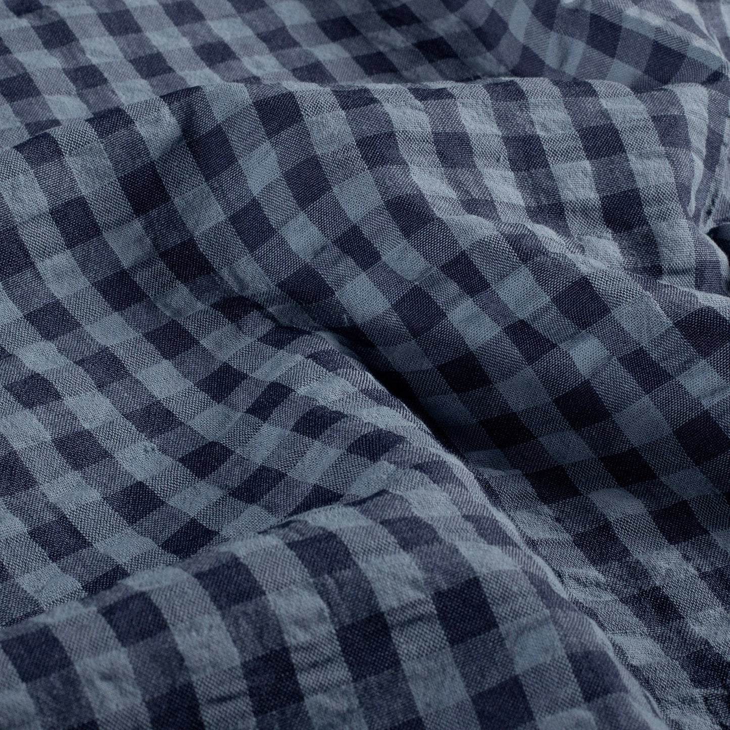 Close-up of blue and navy gingham checkered fabric