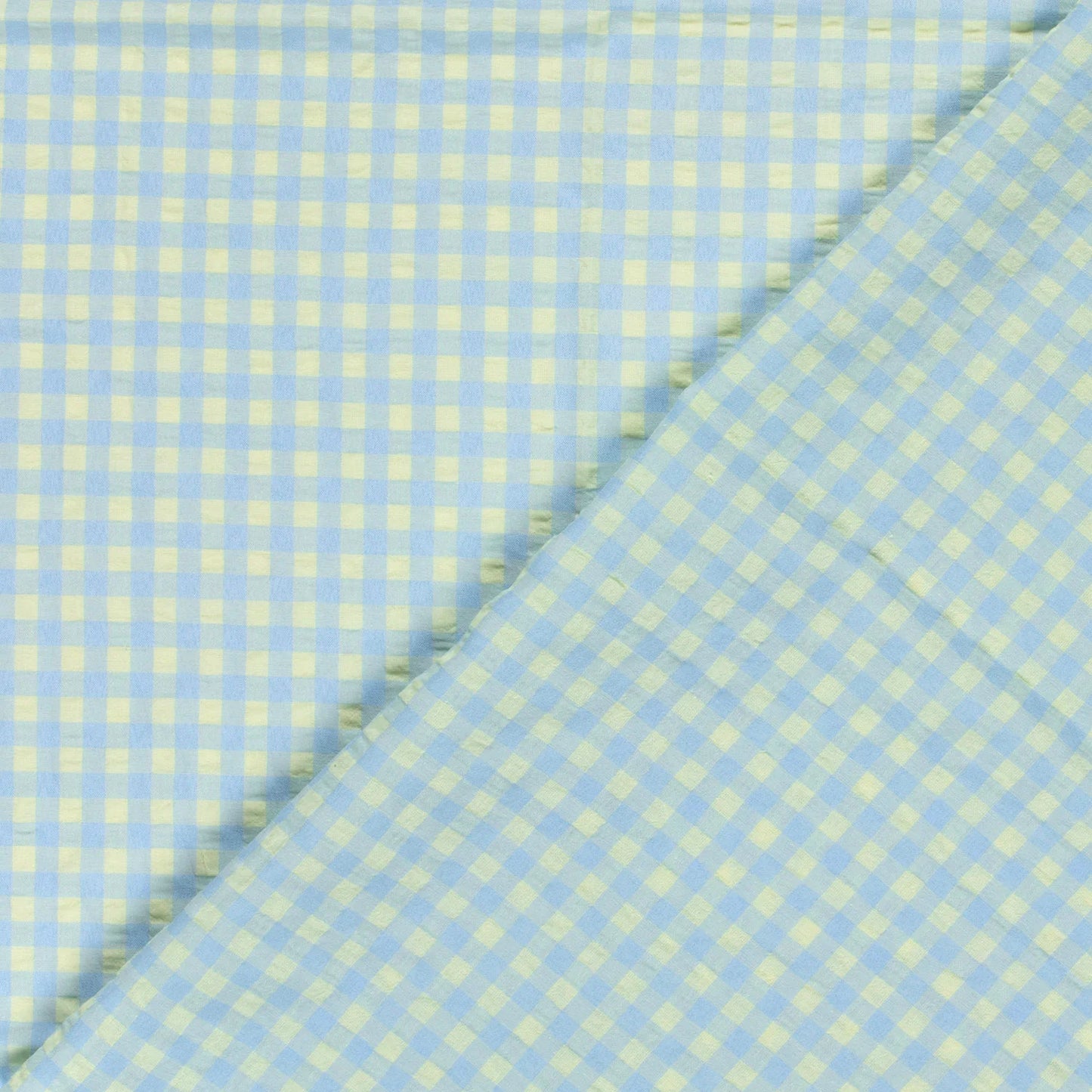 Light blue and pale yellow gingham fabric shown in a close-up folded view.