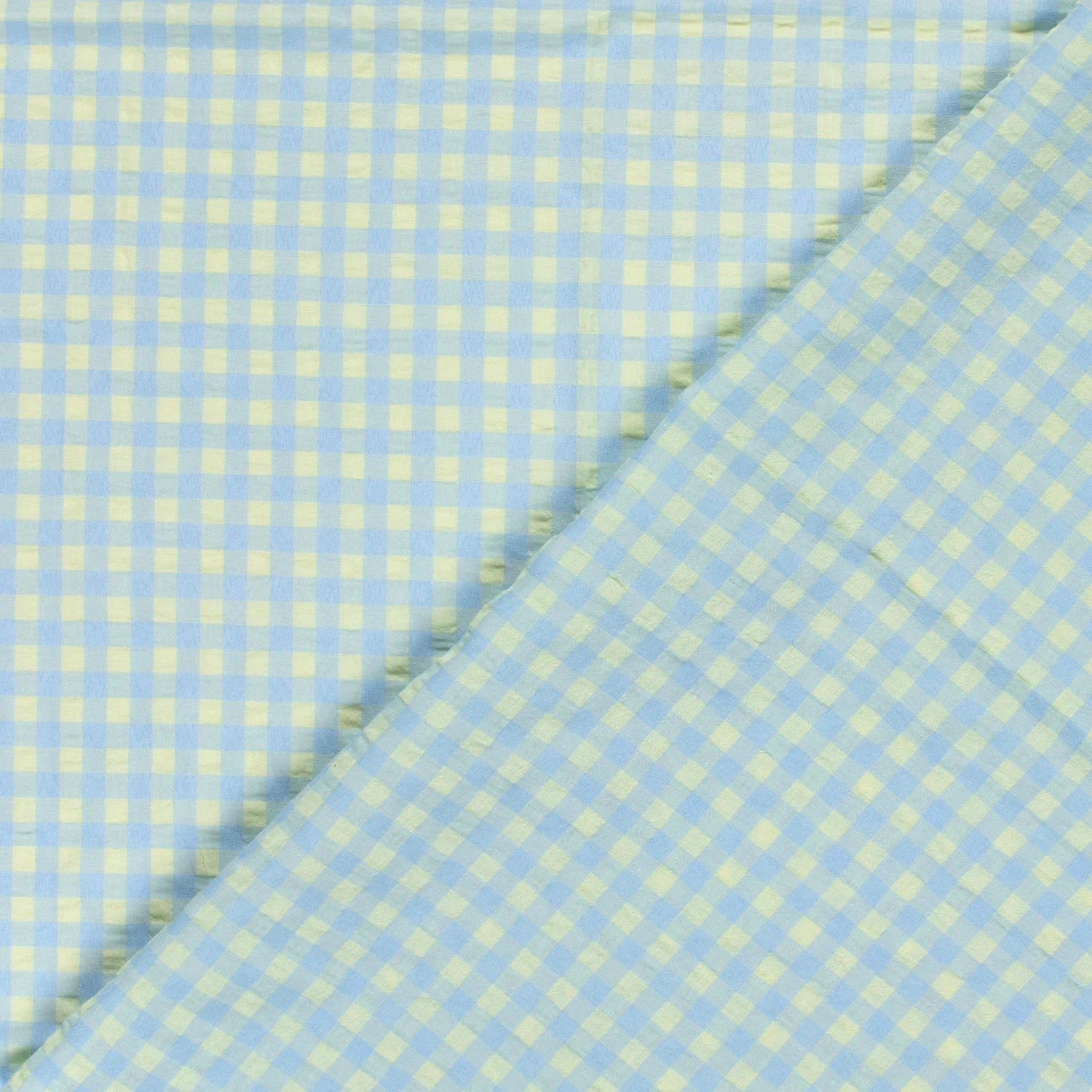 Light blue and pale yellow gingham fabric shown in a close-up folded view.