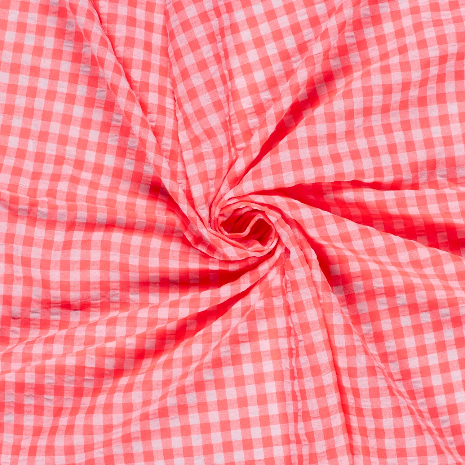 neon pink and white gingham checkered fabric draped in a spiral pattern, showing its texture and pattern details.