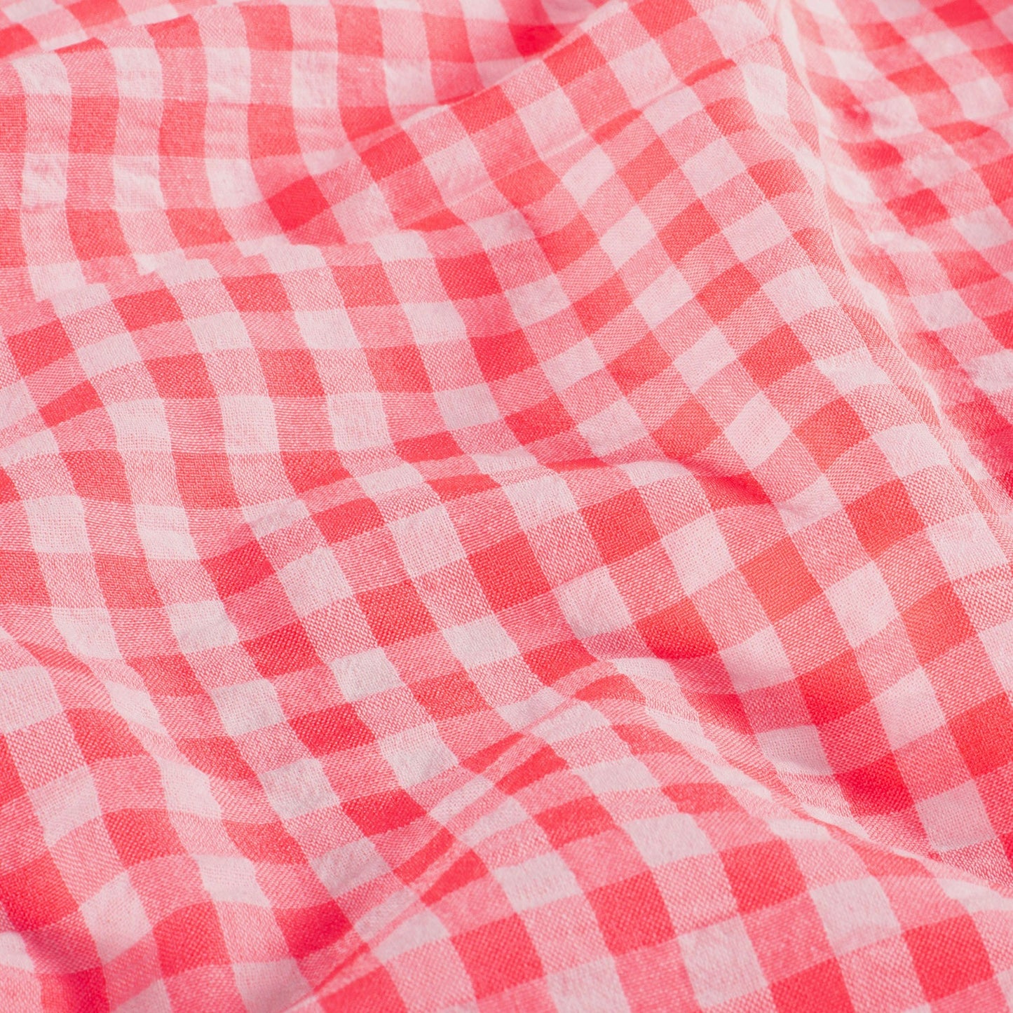 Close-up of neon pink and white checkered fabric