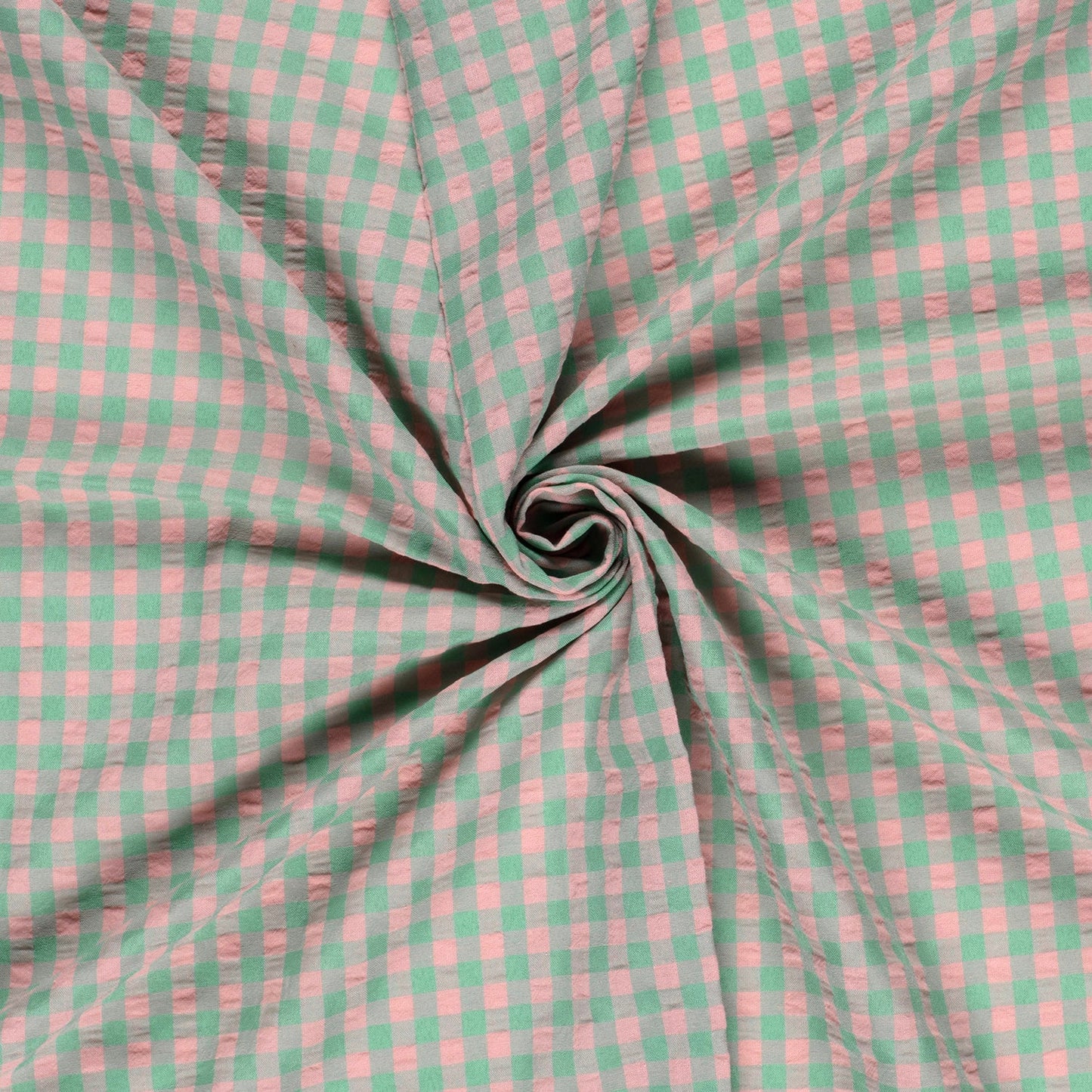 Pink and green checkered fabric in a swirl pattern