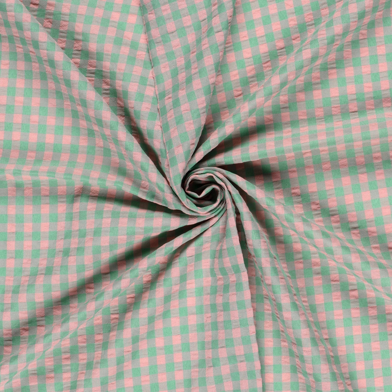 Pink and green checkered fabric in a swirl pattern
