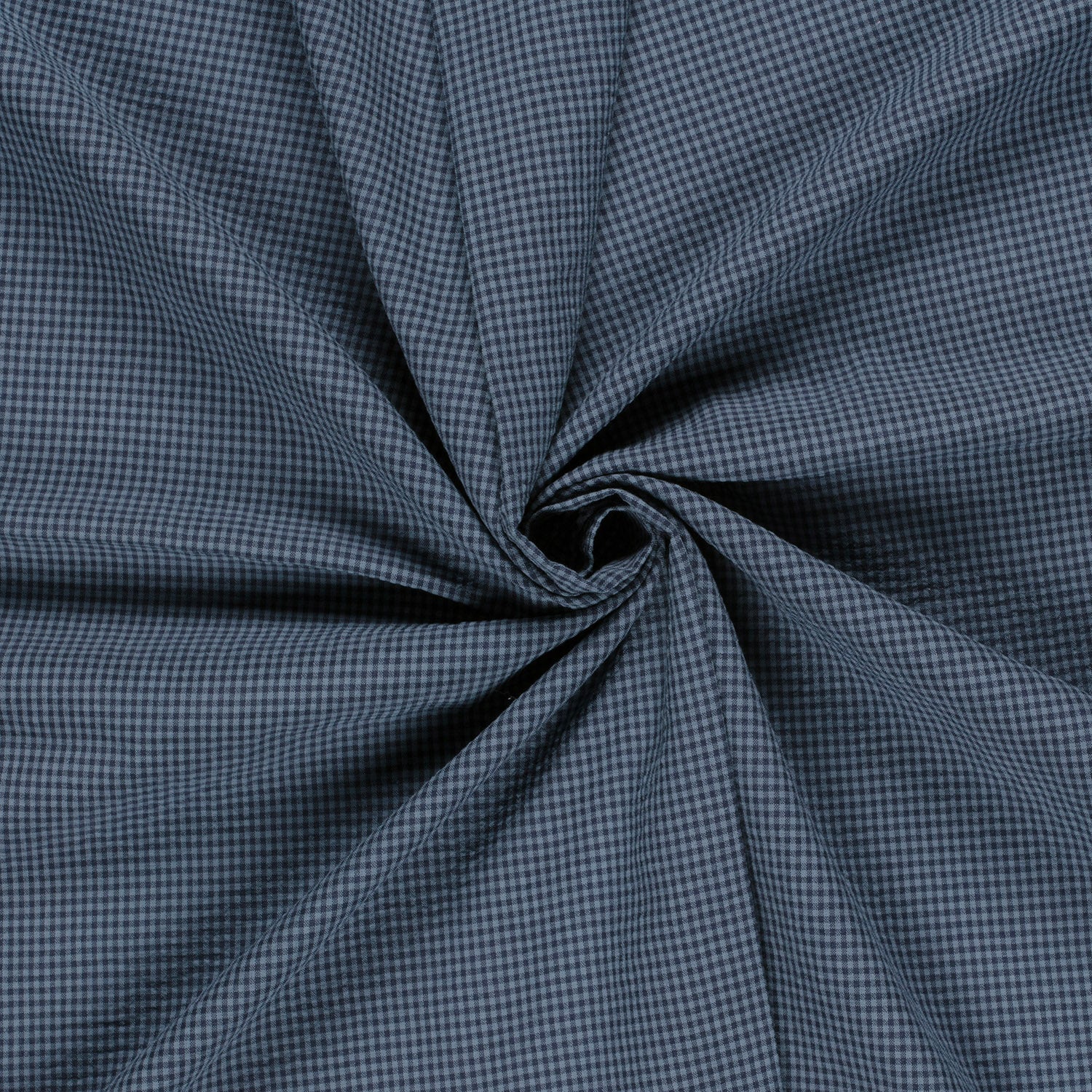 Close-up of blue checkered fabric with a swirl pattern