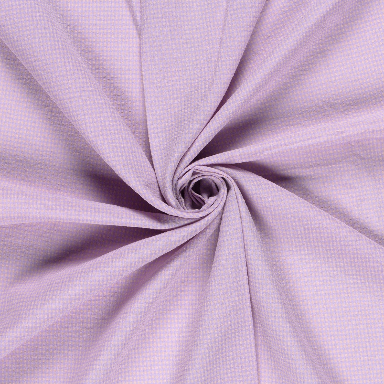 A close-up of lavender purple fabric arranged in a spiral swirl, showing a fine gingham or checkered texture.
