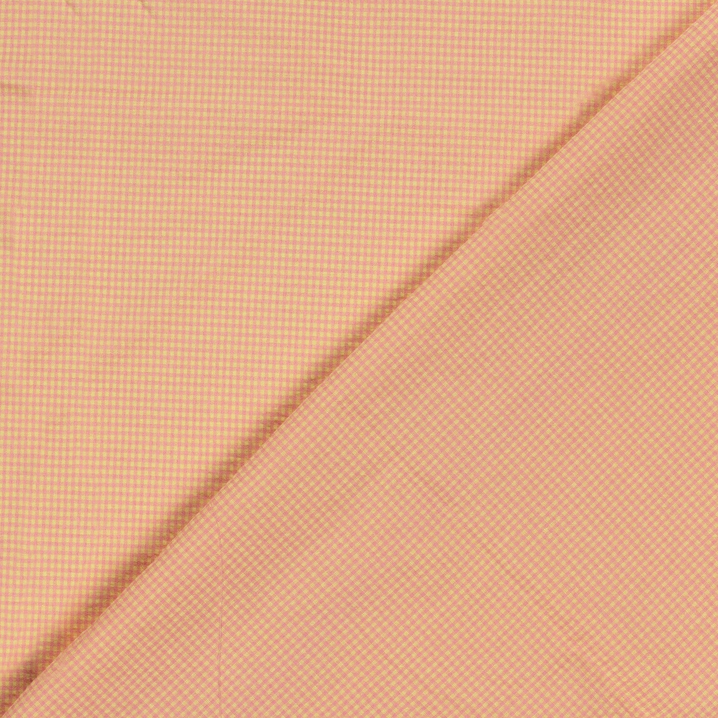 A close-up of pink and yellow fabric with a fine micro-checkered pattern, folded diagonally across the frame.