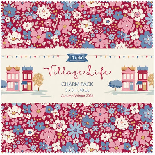 Tidda's Village Life Charm Pack cover art showing a floral patterned design in pink, blue, and white, with small illustrated houses and text reading 'Village Life CHARM PACK 5 x 5 in, 40 pc Autumn/Winter 2026'.