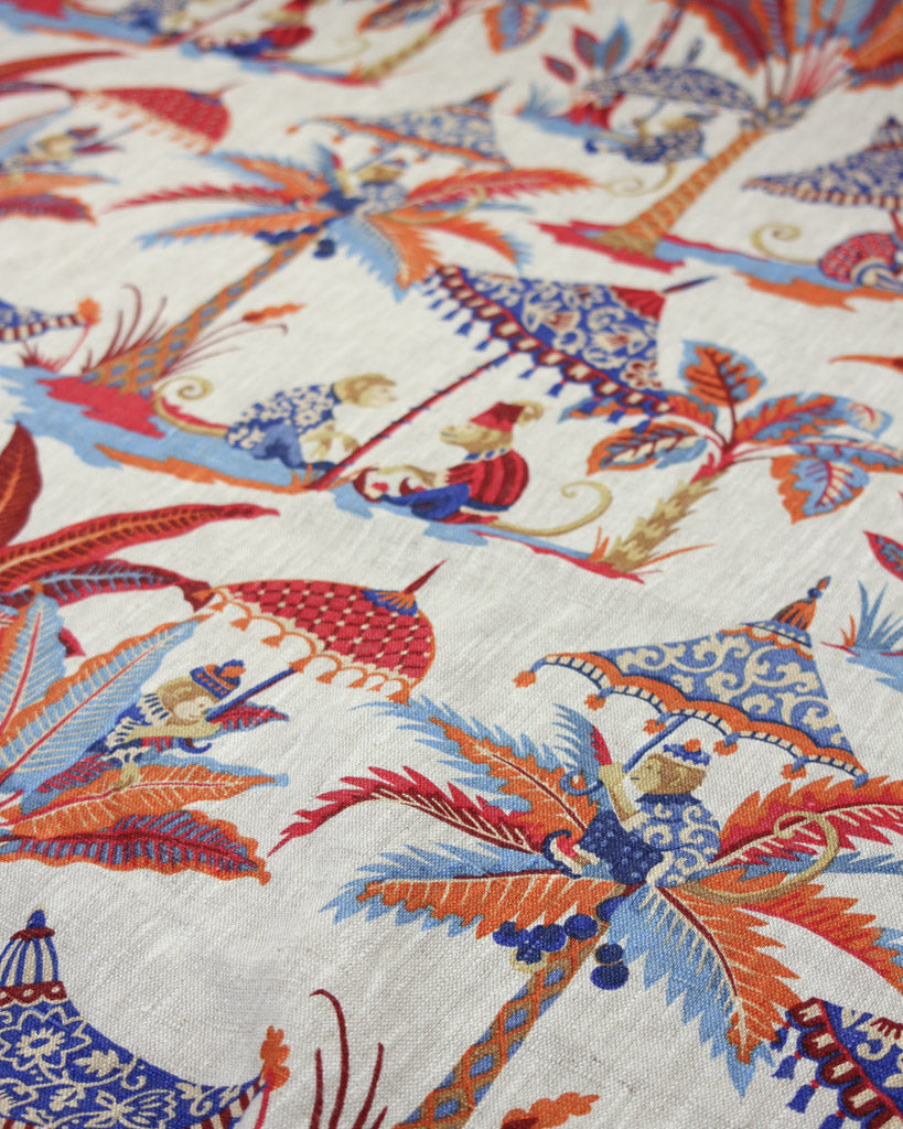 Bright red orange and blue design with monkeys and parasols on a neutral linen curtain fabric