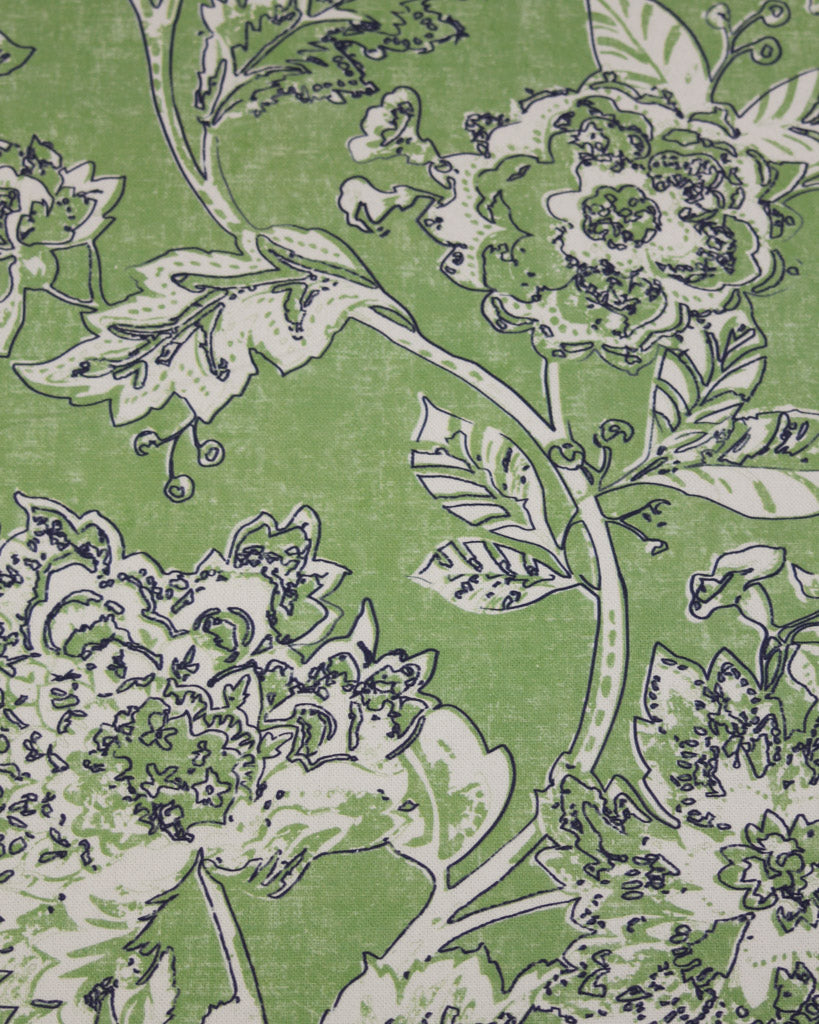 Floral pattern with green leaves and white flowers on a green curtain weight fabric
