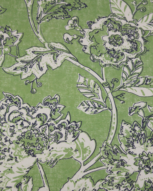 Floral pattern with green leaves and white flowers on a green curtain weight fabric