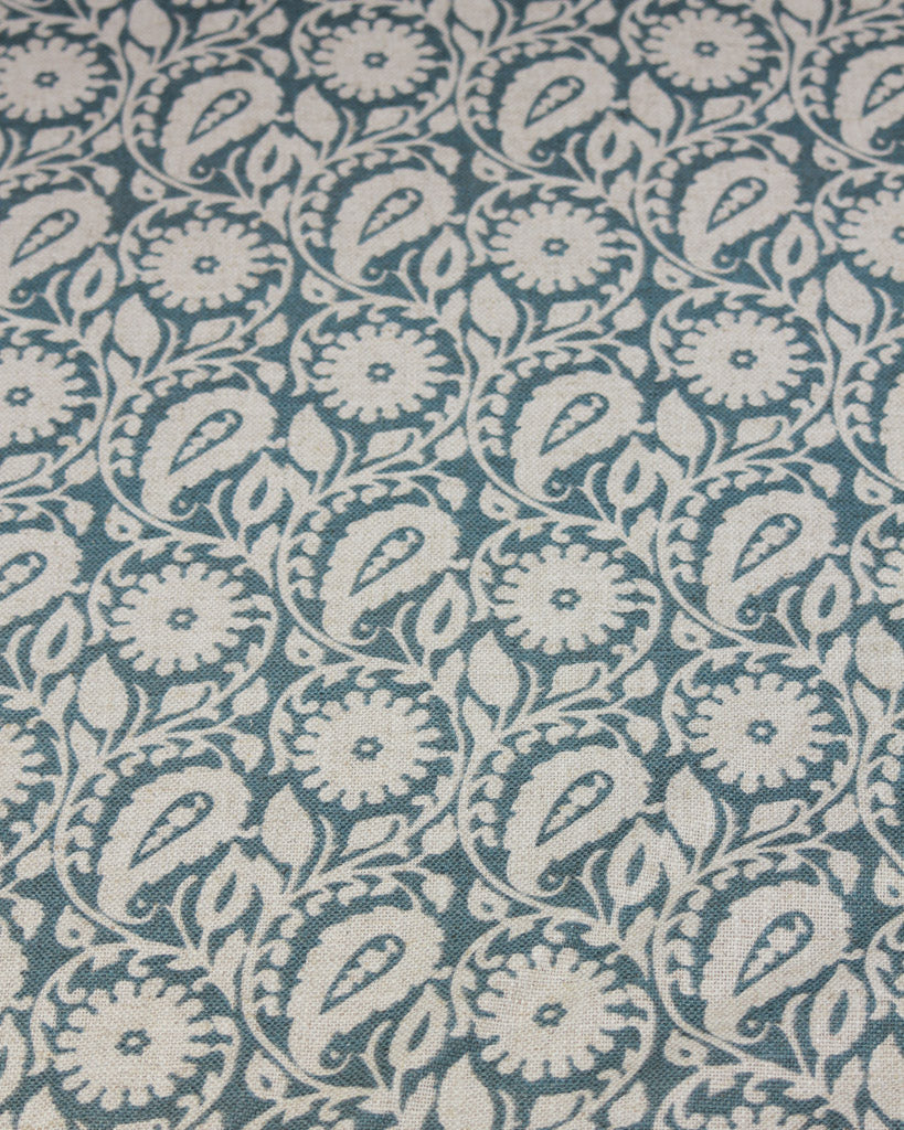 Patterned  interiors fabric with white paisley design on a blue background