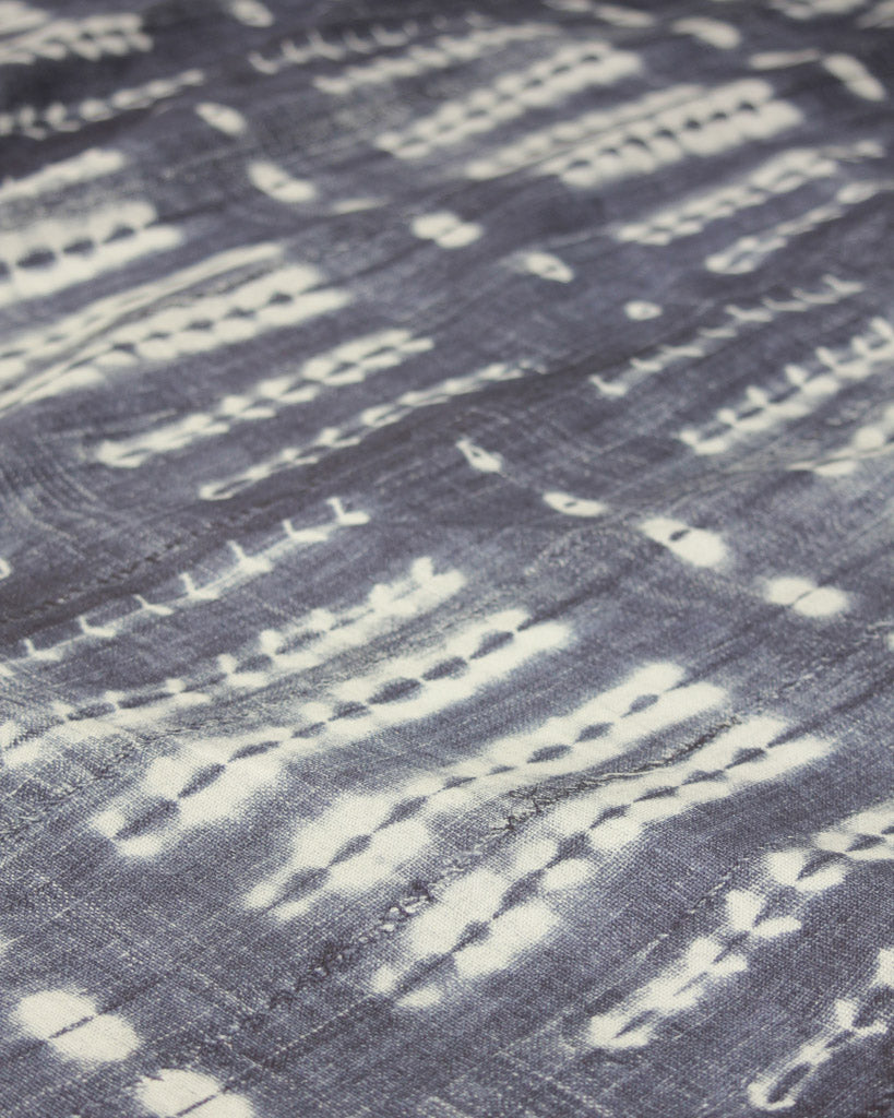 Tie dye effect curtain fabric, white pattern on an indigo blue cotton 