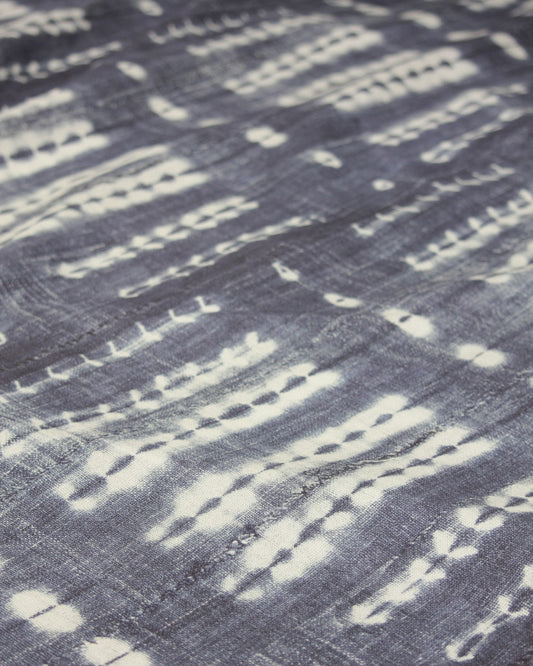 Tie dye effect curtain fabric, white pattern on an indigo blue cotton 