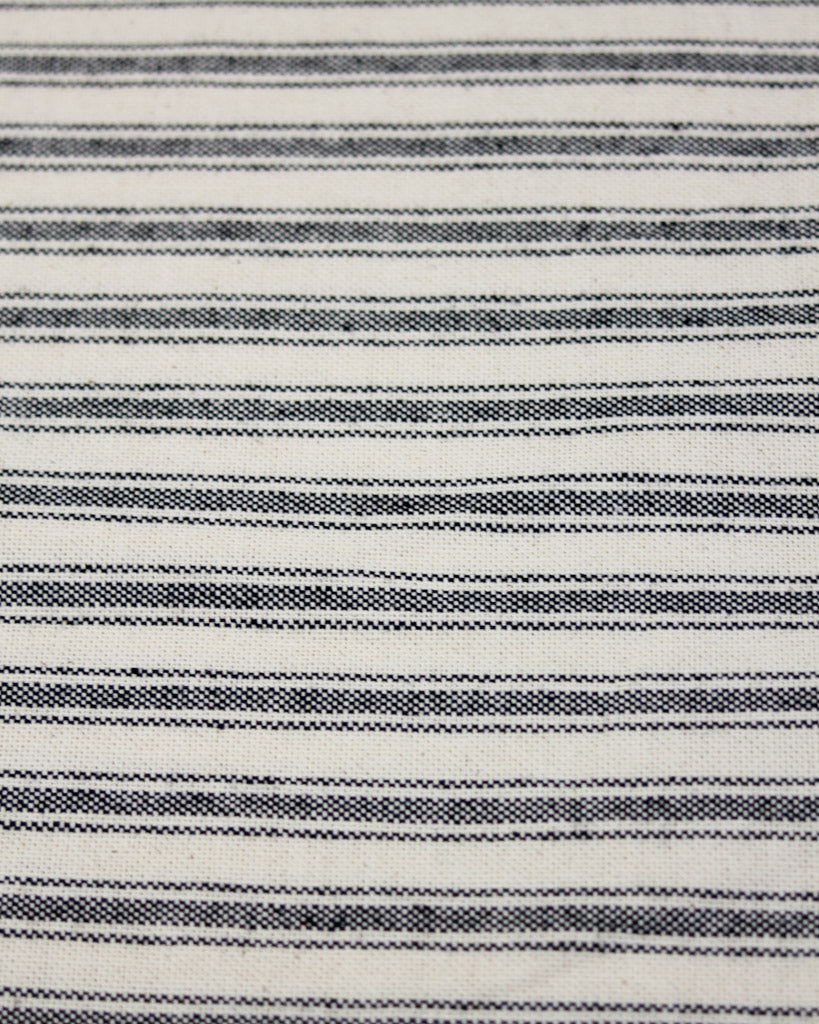 Black striped ticking fabric on a neutral polycotton base