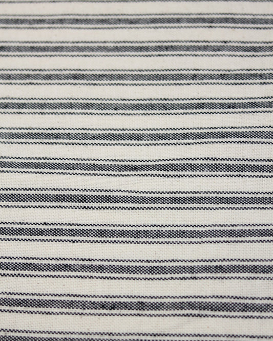 Black striped ticking fabric on a neutral polycotton base