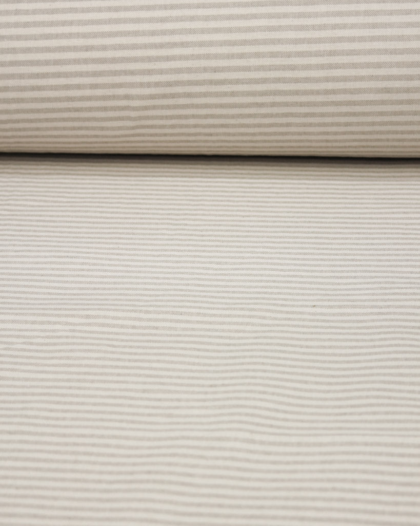 Close-up of beige striped curtain fabric