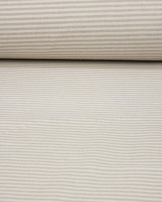 Close-up of beige striped curtain fabric