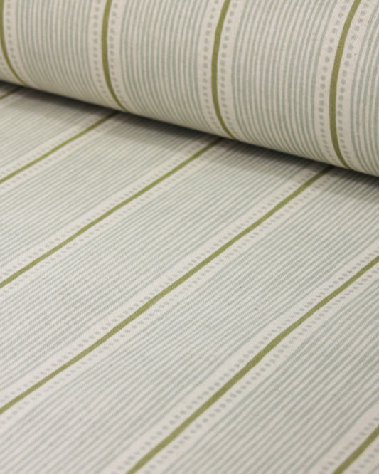 Roll of curtain fabric with green stripes on a white background