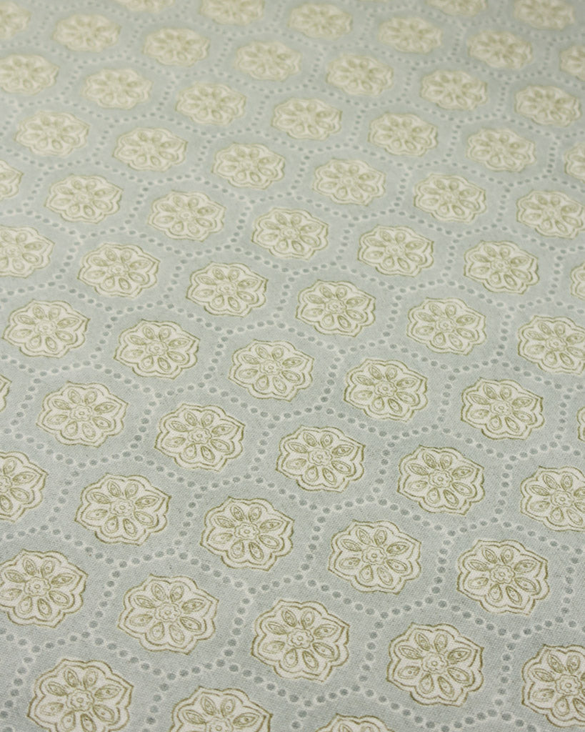 Patterned furnishing fabric with floral design on a light blue background