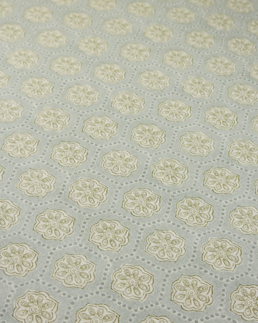 Patterned furnishing fabric with floral design on a light blue background