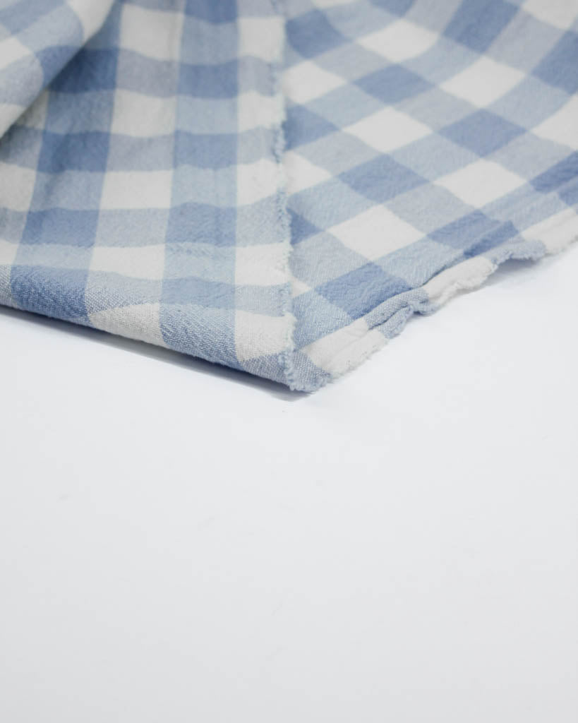 Blue and white checkered fabric on a white background