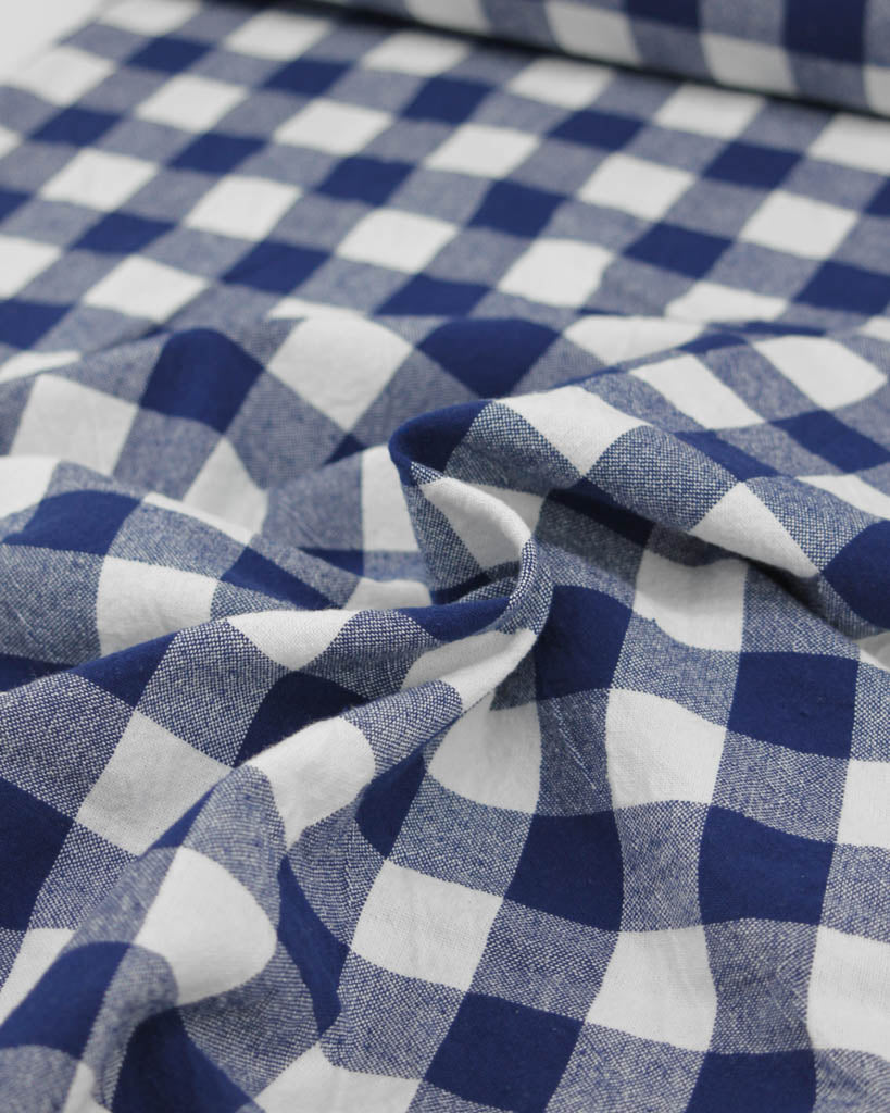 Close-up of blue and white checkered gingham cotton fabric