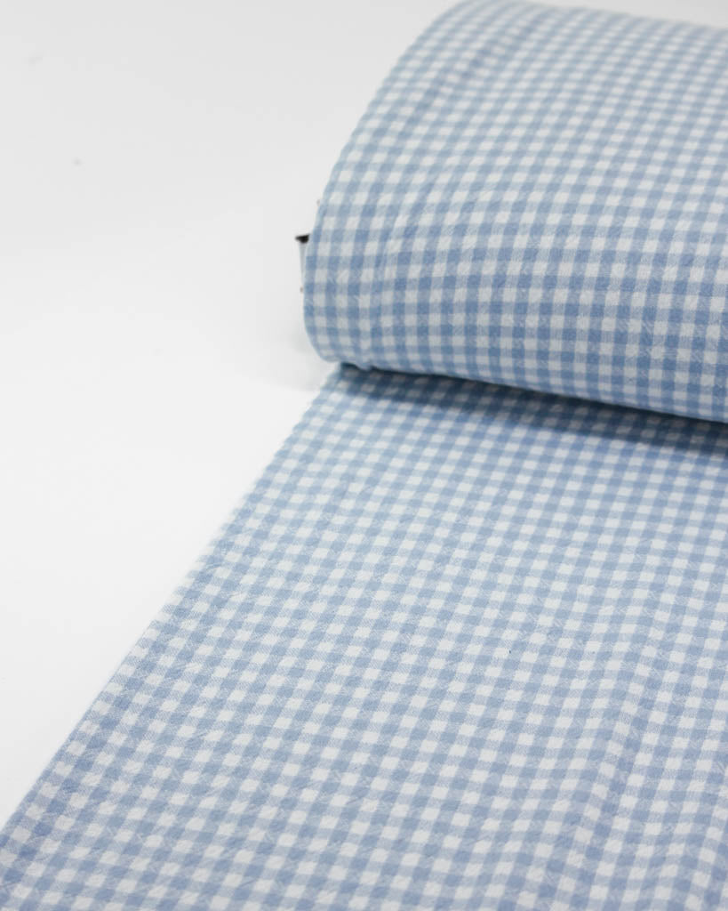 Bolt of baby blue and white checkered gingham organic cotton fabric