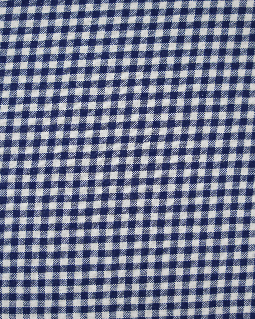 Close up of royal blue and white organic cotton gingham fabric