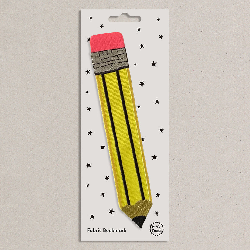 Fabric bookmark shaped like a yellow pencil on a white presentation card