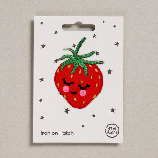 Petra Boase strawberry iron-on embroidered patch featuring a bright red strawberry with green leaves on presentation card.