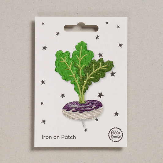 Petra Boase turnip iron-on embroidered patch featuring a purple and white turnip with green leaves on presentation card.