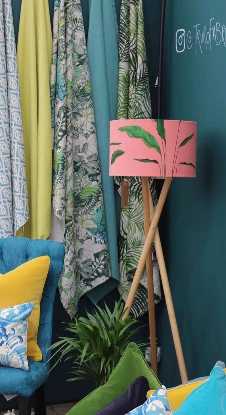 Handcrafted pink lampshade with colourful cushions and fabric in the Truro Fabrics showroom
