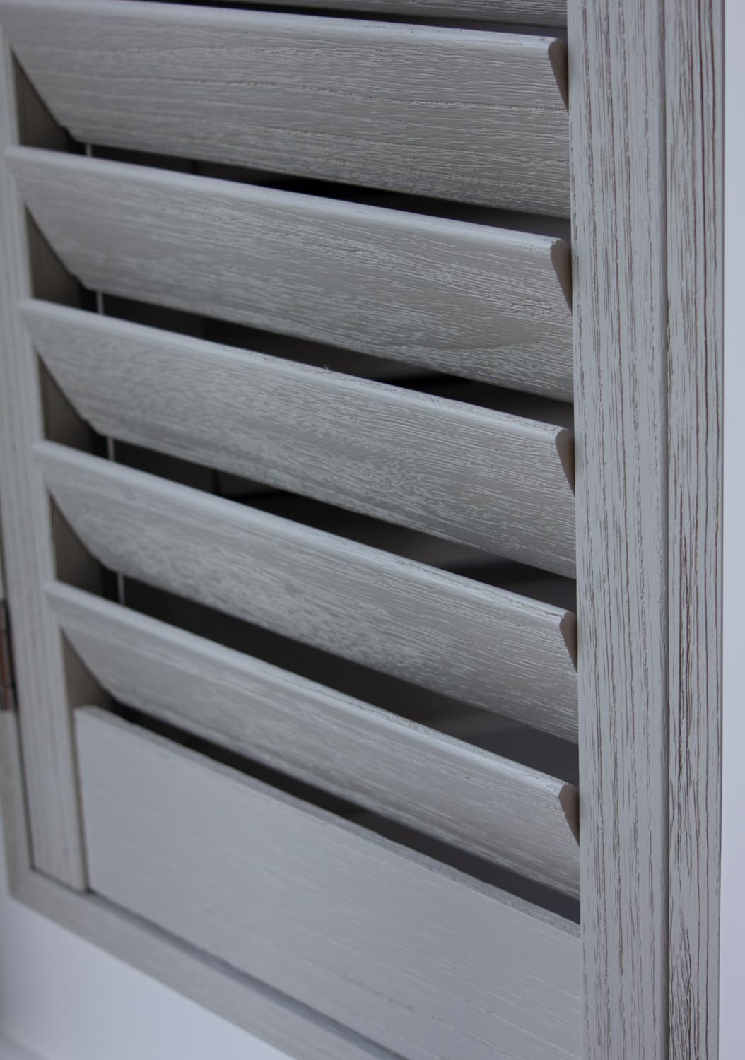 Close detail of painted grey bespoke shutter louvres