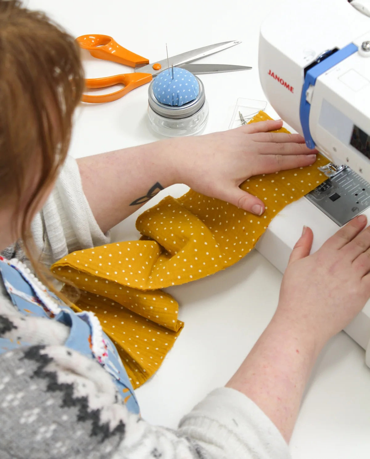 Close-up of a sewing machine demonstration at Truro Fabrics