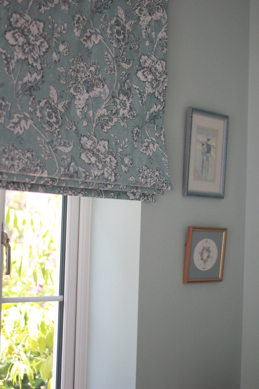Floral made-to-measure Roman blind at a window