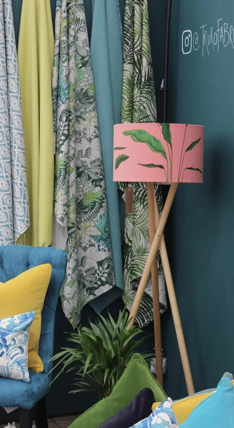 Truro Fabrics interiors display with patterned fabrics and lampshade